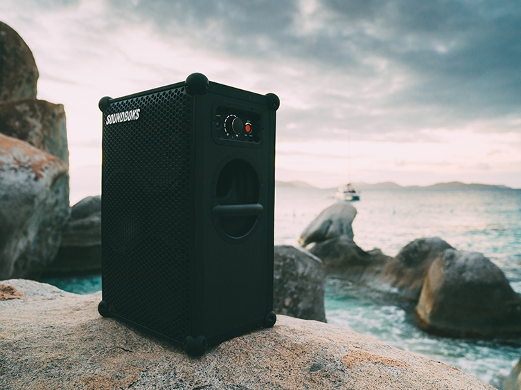 SOUNDBOKS speaker on a rock by the ocean