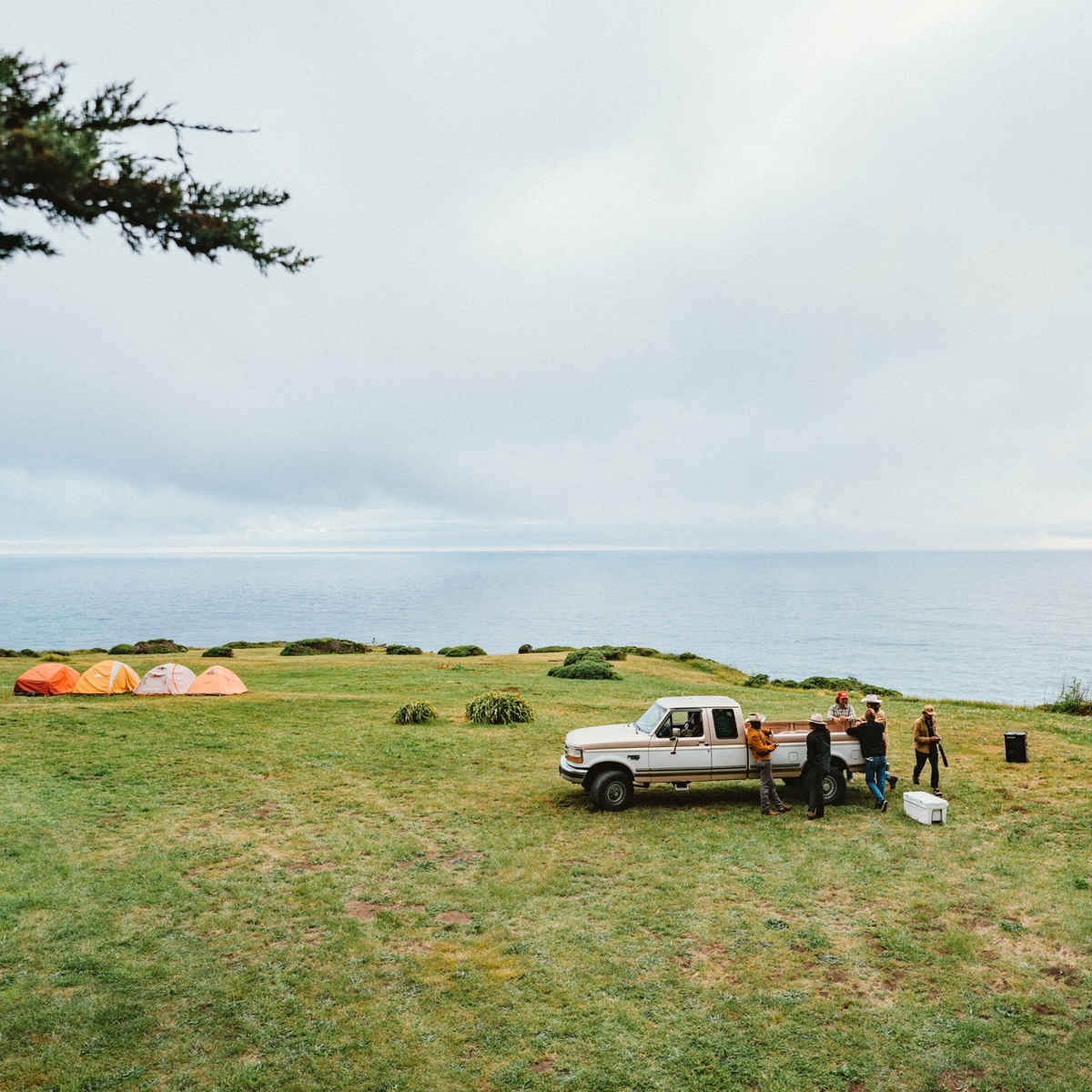 Camping in a vast field with a truck and a SOUNDBOKS