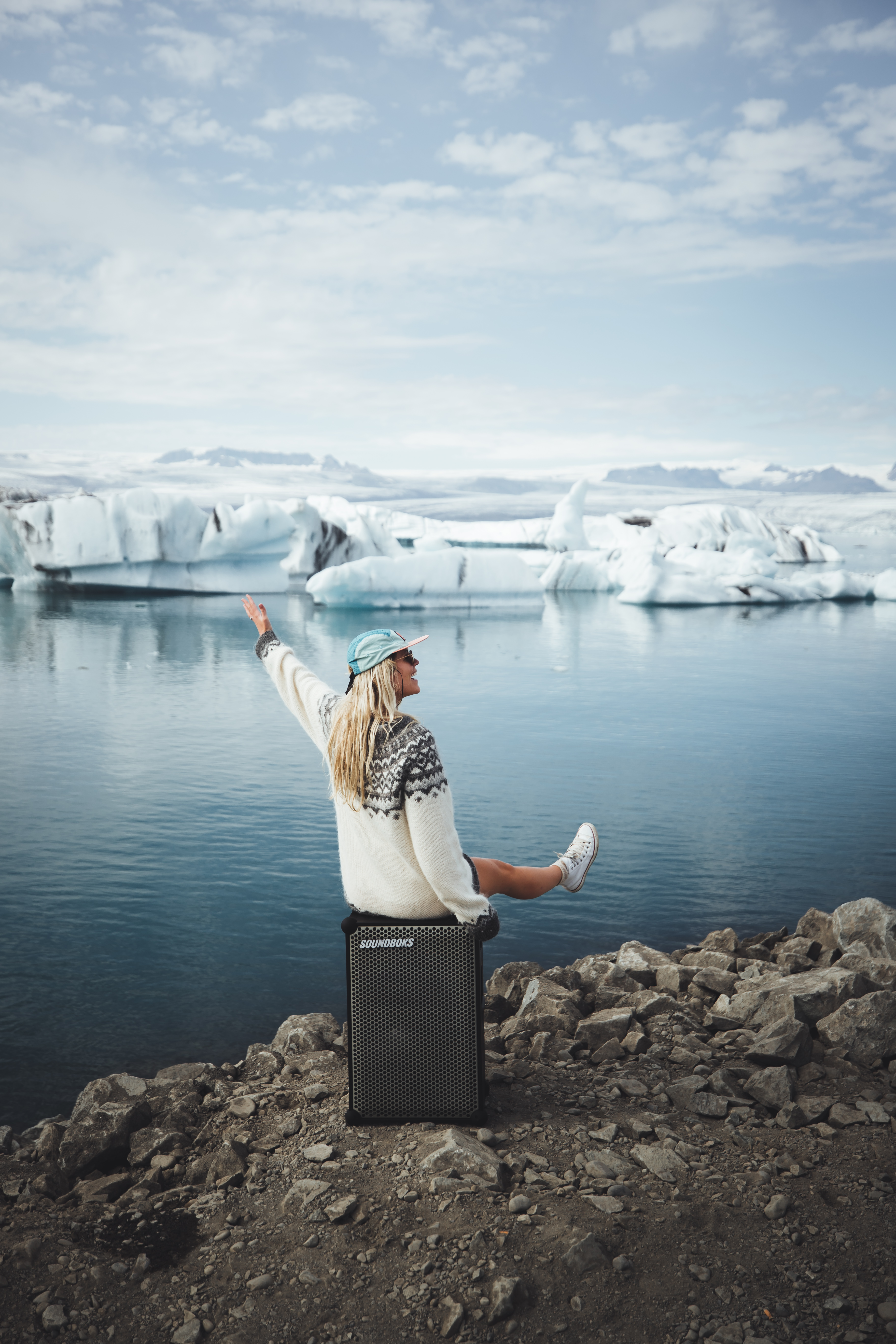 Asa sitting on a SOUNDBOKS in front of an iceburg