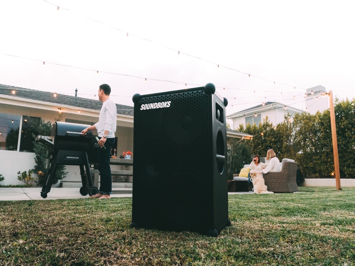 SOUNDBOKS Bluetooth Speaker in a backyard