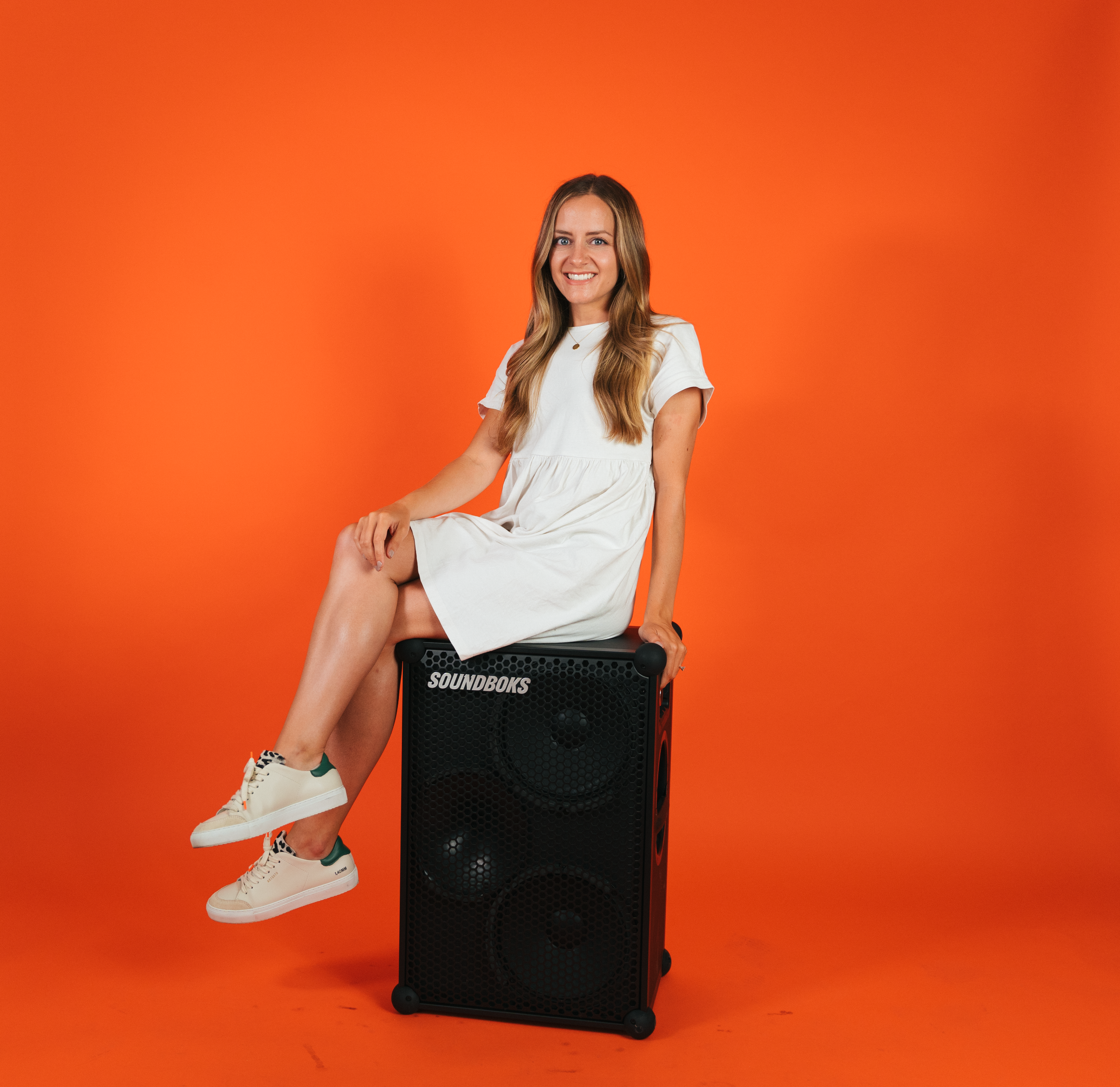 Hannah sitting on a SOUNDBOKS