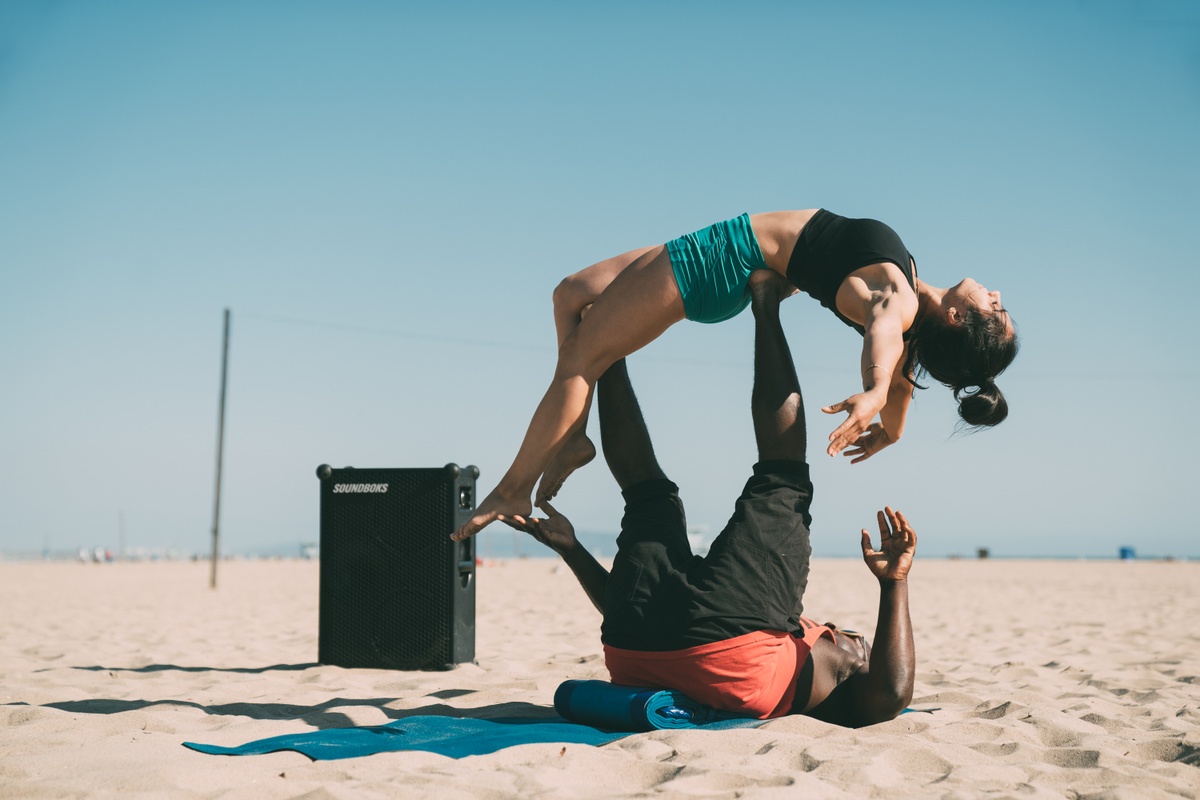 Victor doing acro on the beach