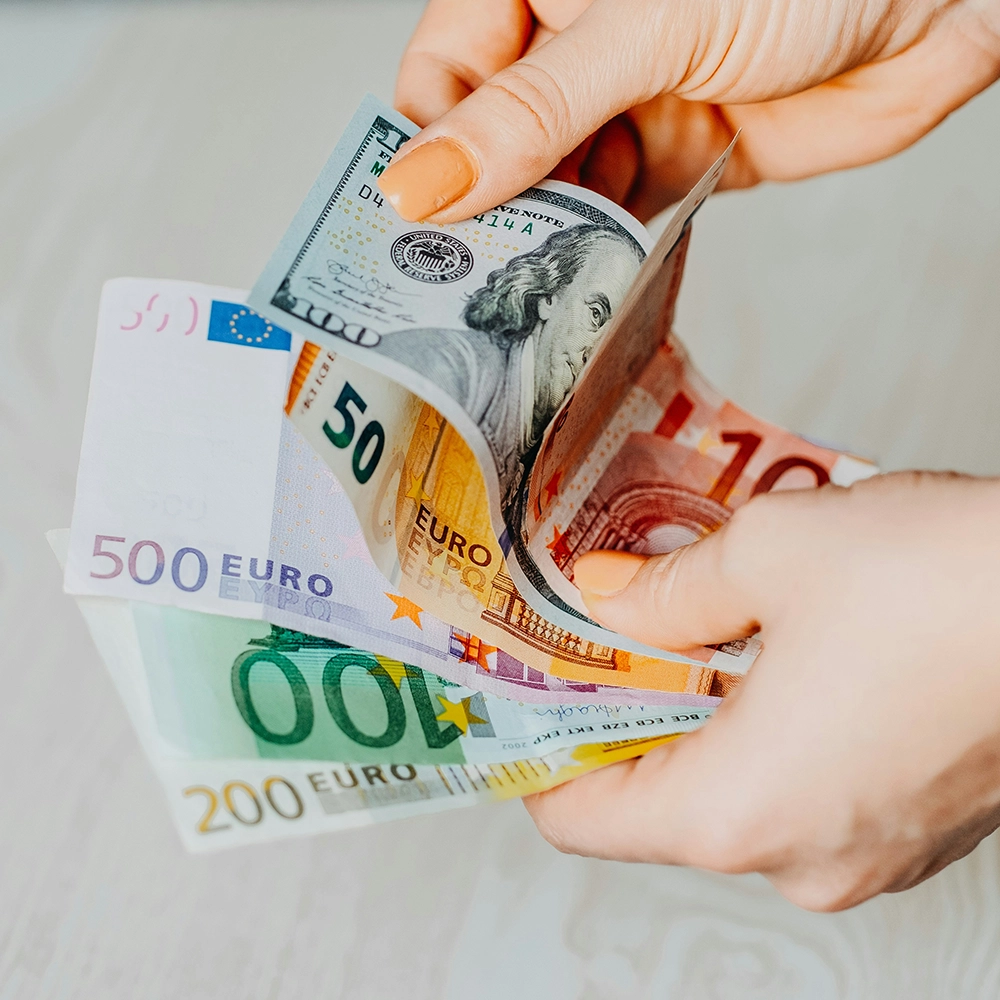 Holding Different Currencies.webp