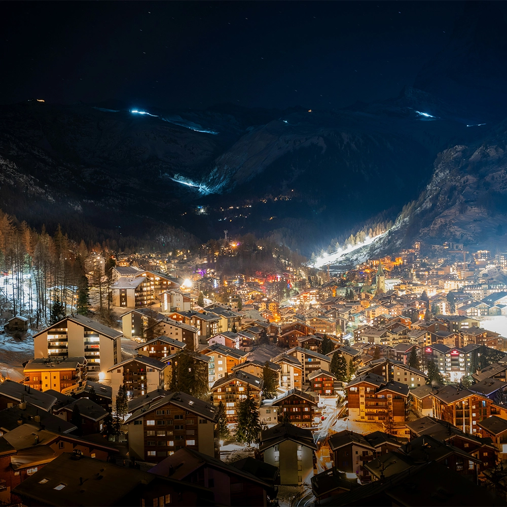 View of Zermatt, Switzerland lit up at night.