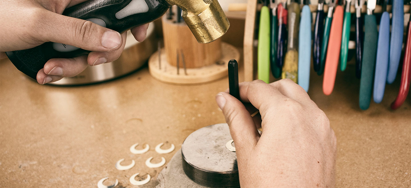 Read our how-to guide to get started with metal stamping your own jewelry designs using metal blanks, stamps and hammer. We've included stamping tips, too!
