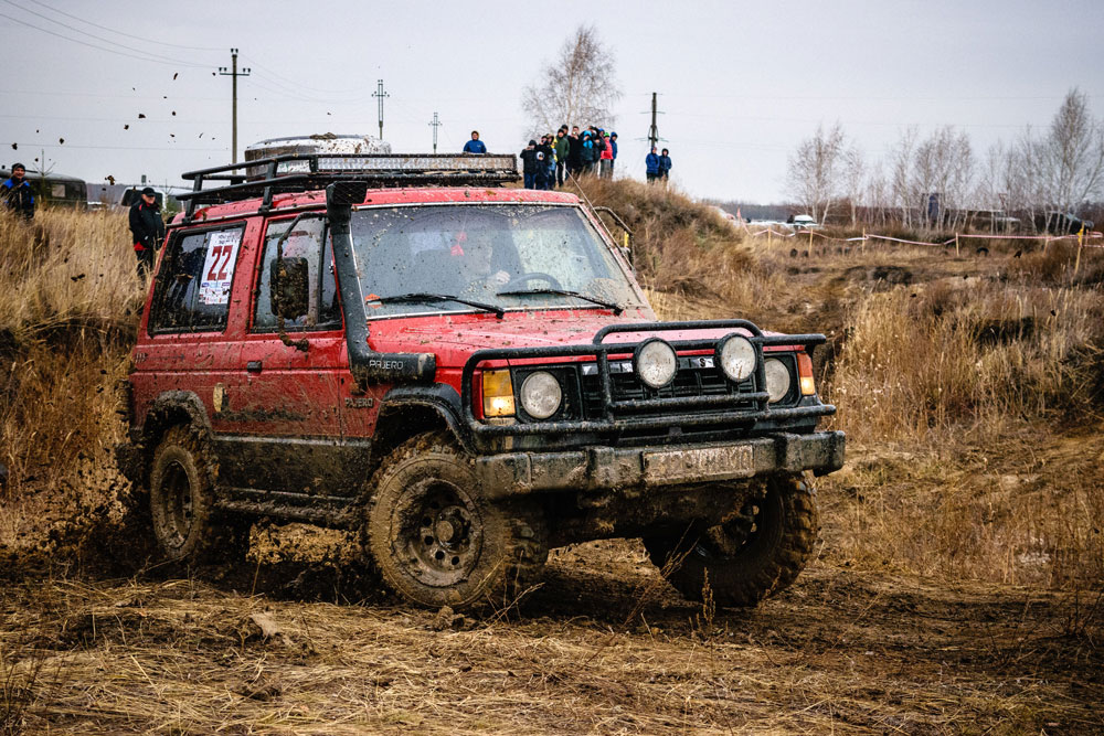 An off-roading vehicle covered in mud.