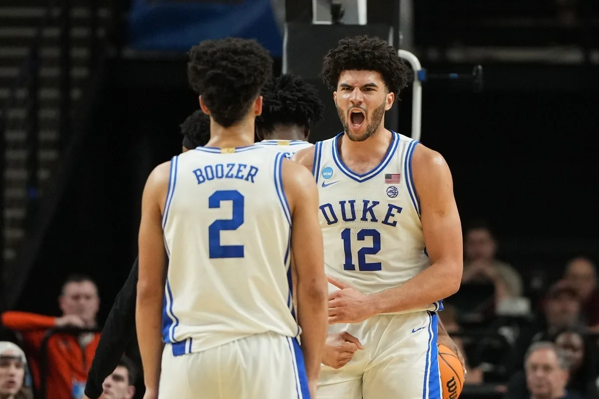 Mar 21, 2026; Greenville, SC, USA; Duke Blue Devils forward Cameron Boozer (12) reacts with guard Cayden Boozer (2) in the second half during a second round game of the men's 2026 NCAA Tournament at Bon Secours Wellness Arena.