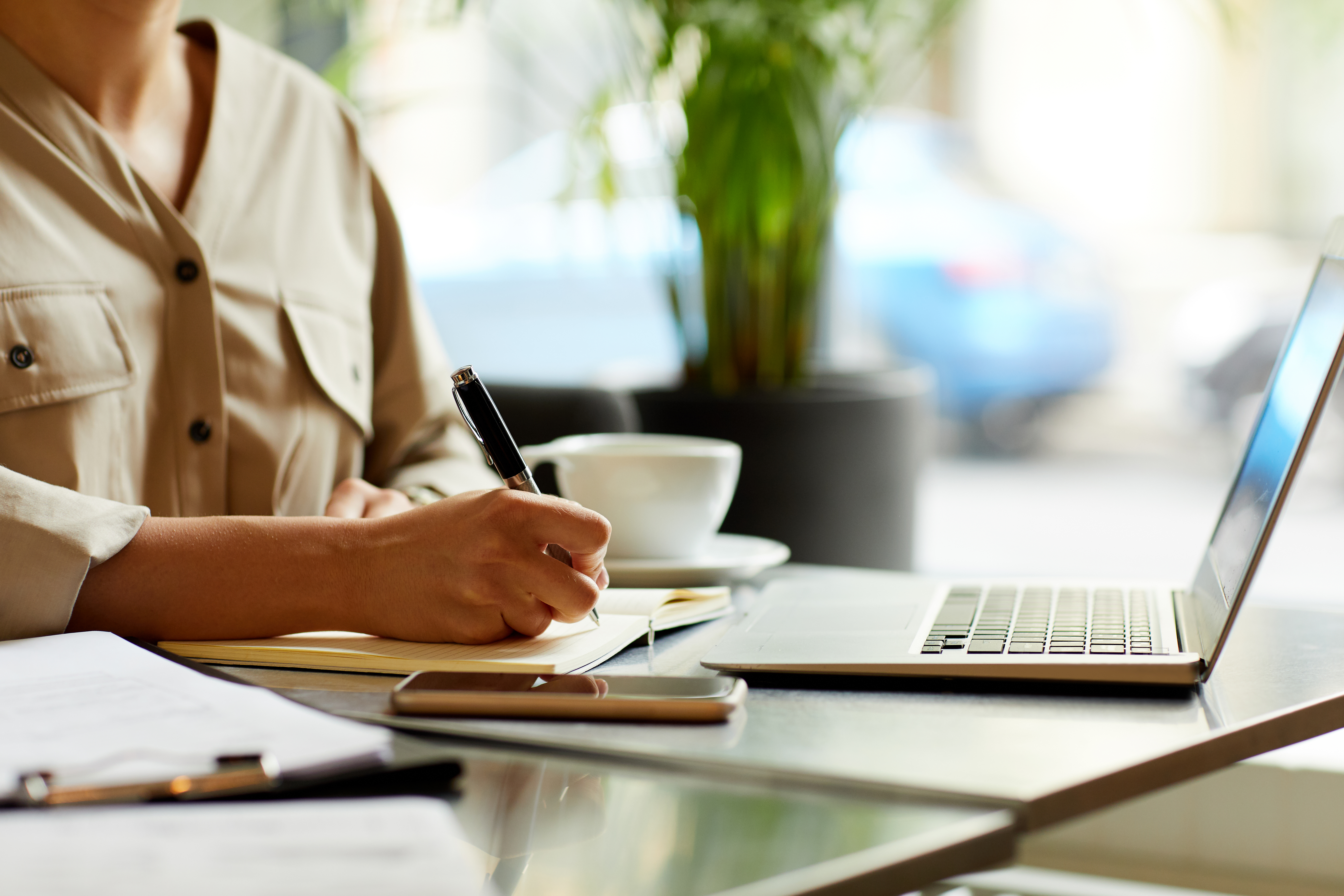 Woman writing down plans