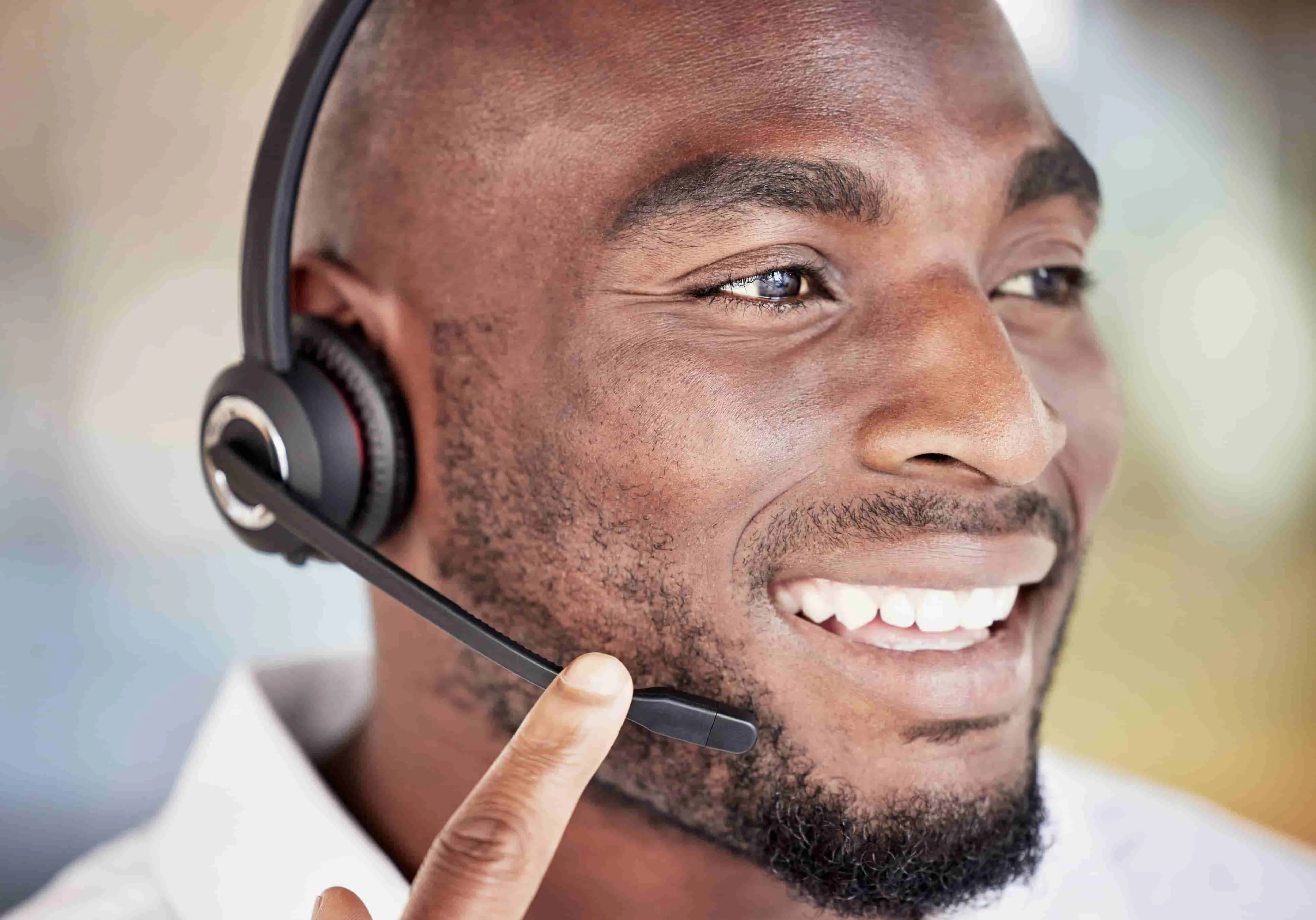 Customer service representative smiling at desk