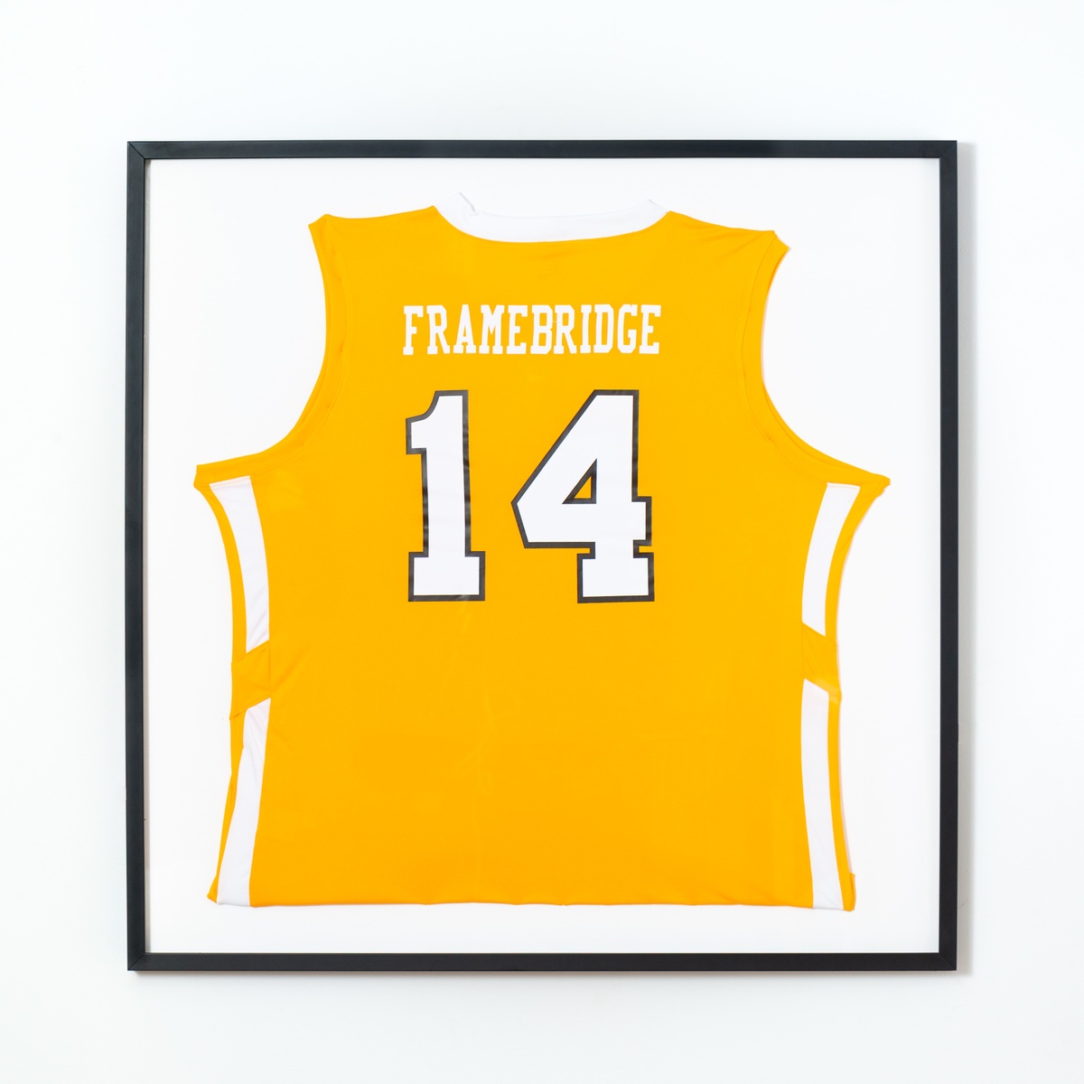 yellow basketball jersey in black frame