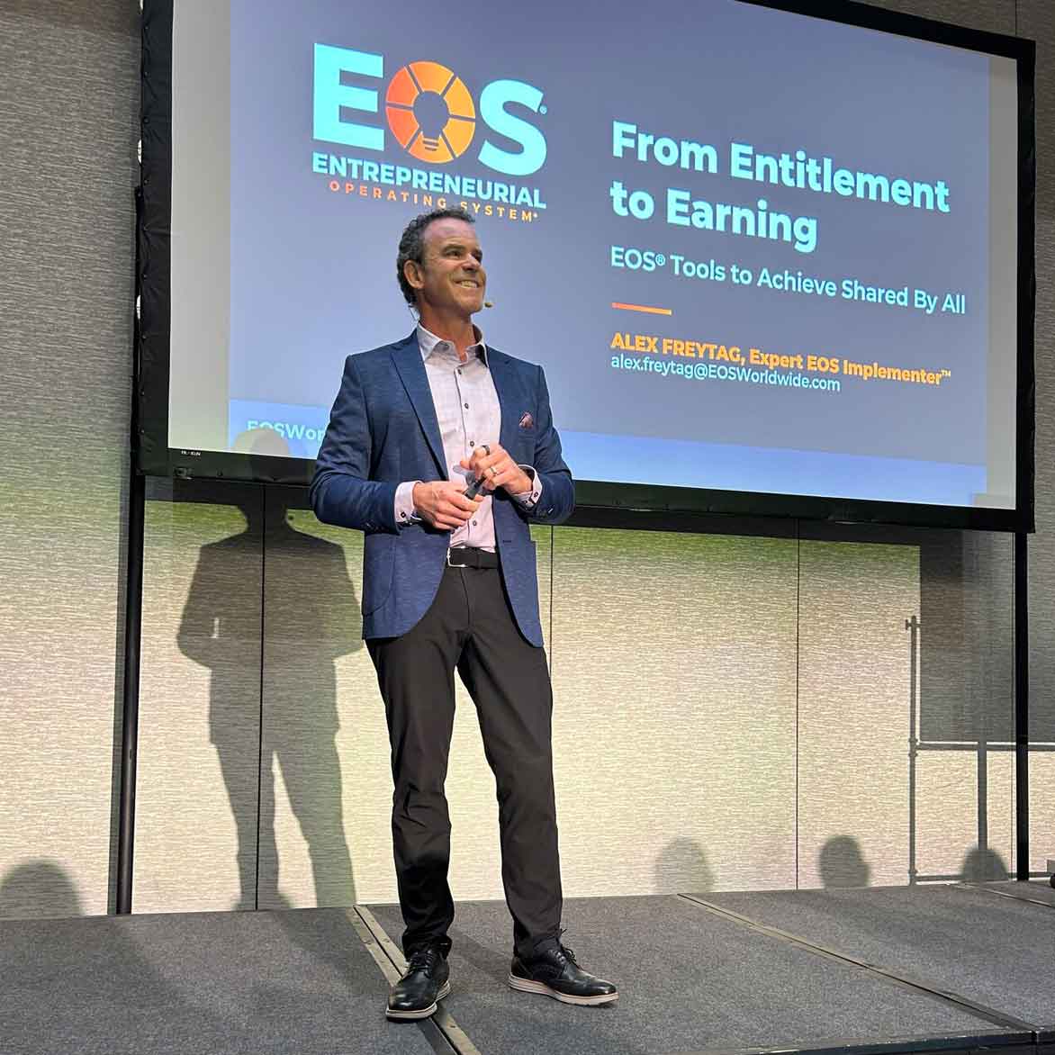 Strategic Coach member, Alex Freytag speaking at an EOS event. 