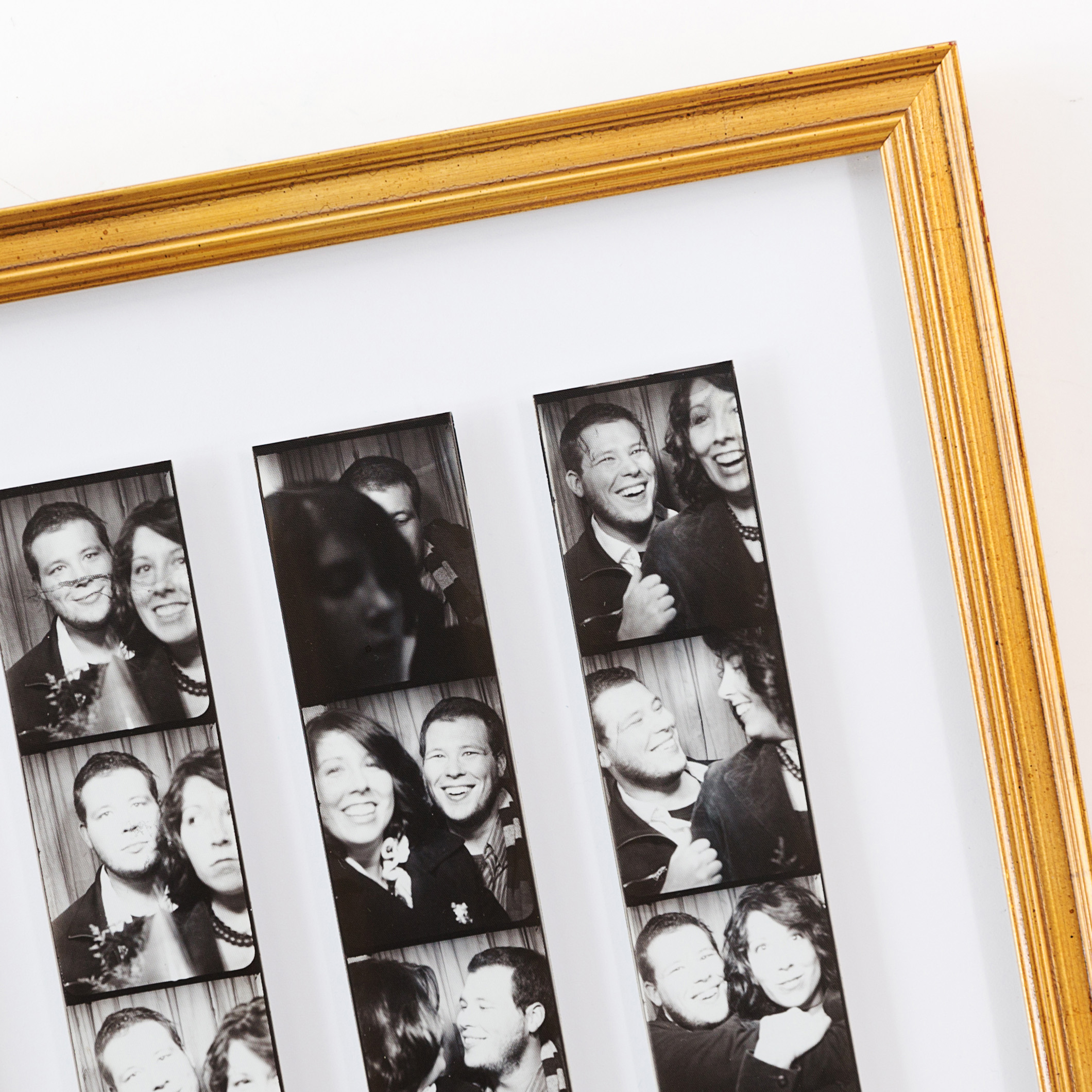 Black & White photo strips framed in thin gold richmond frame
