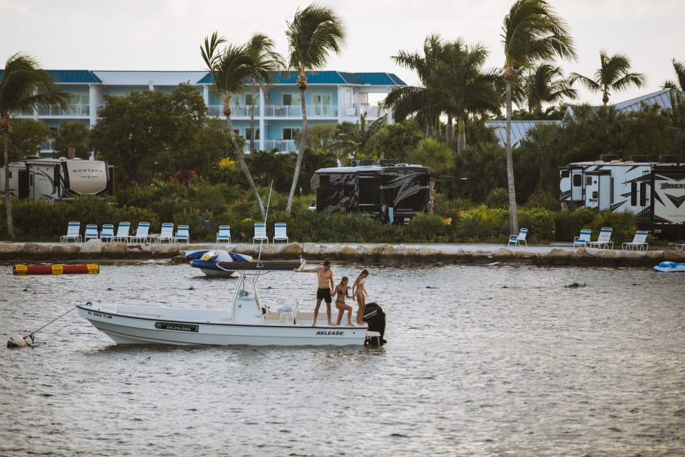 family jumping off boat at florida keys rv campground