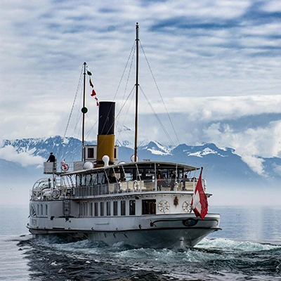 Ship with snowy mountain background.