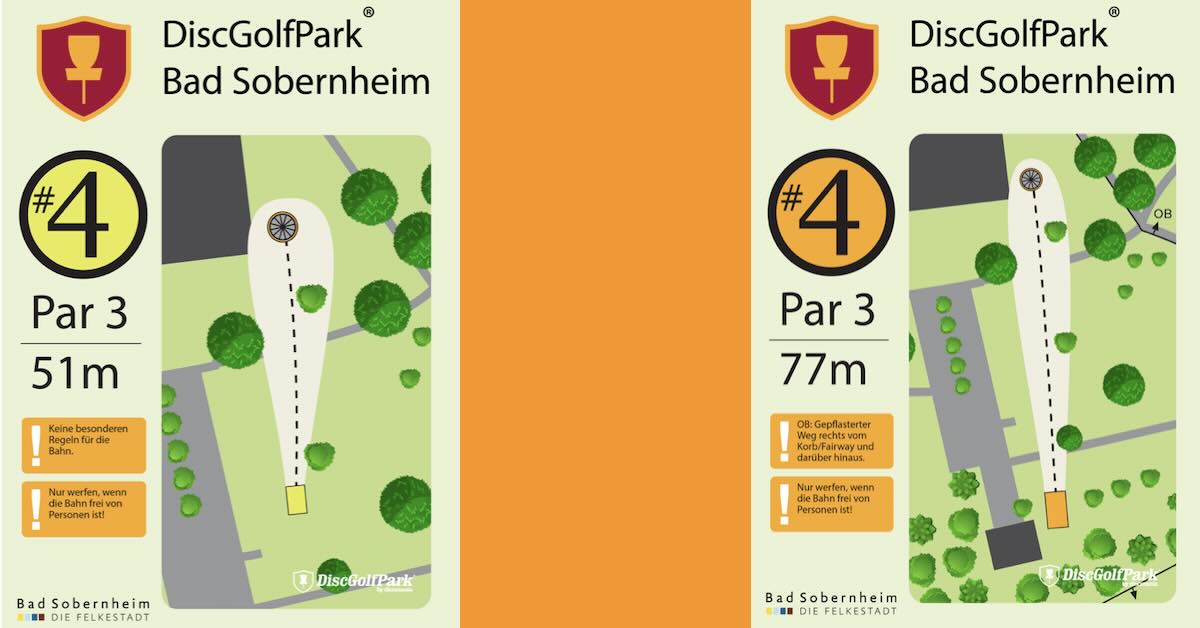 Two disc golf tee signs with orange between