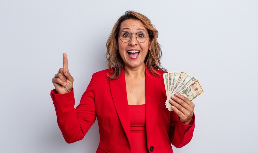 woman holding payday loan money