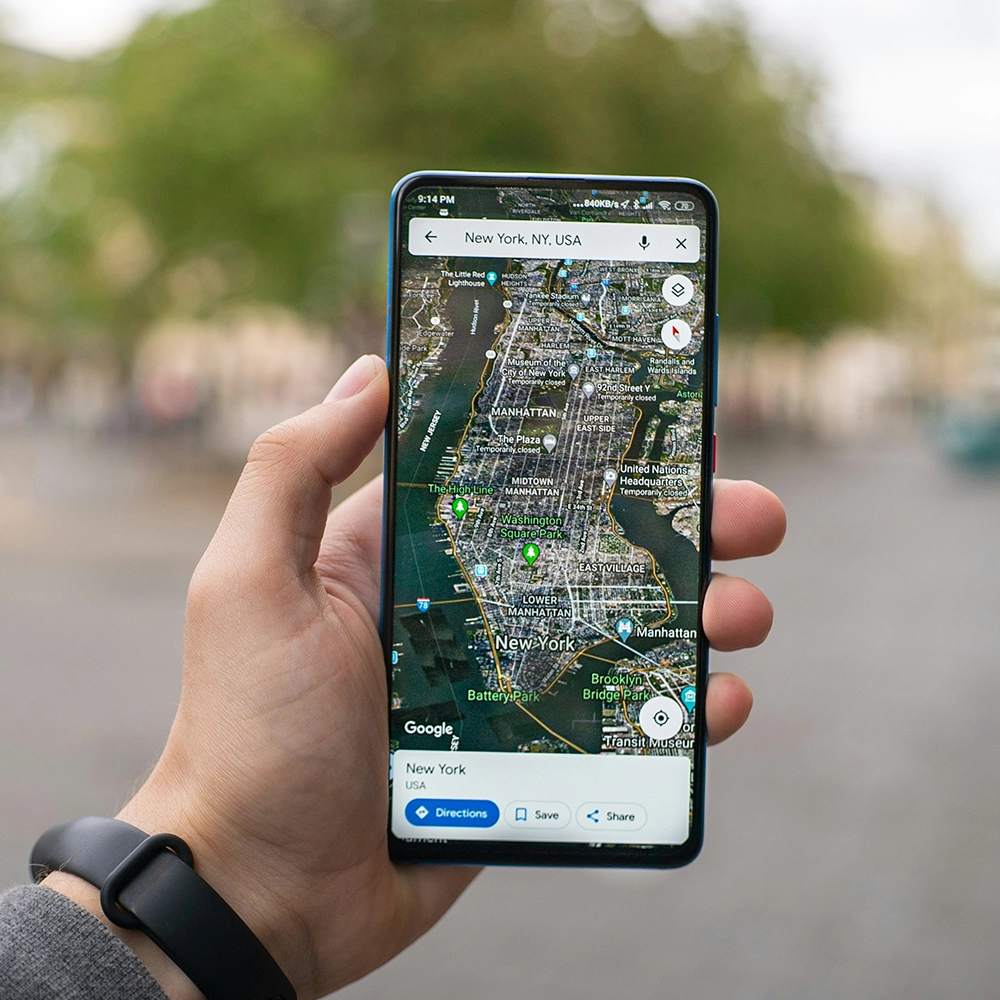 Person holding up a downloaded map on a phone.
