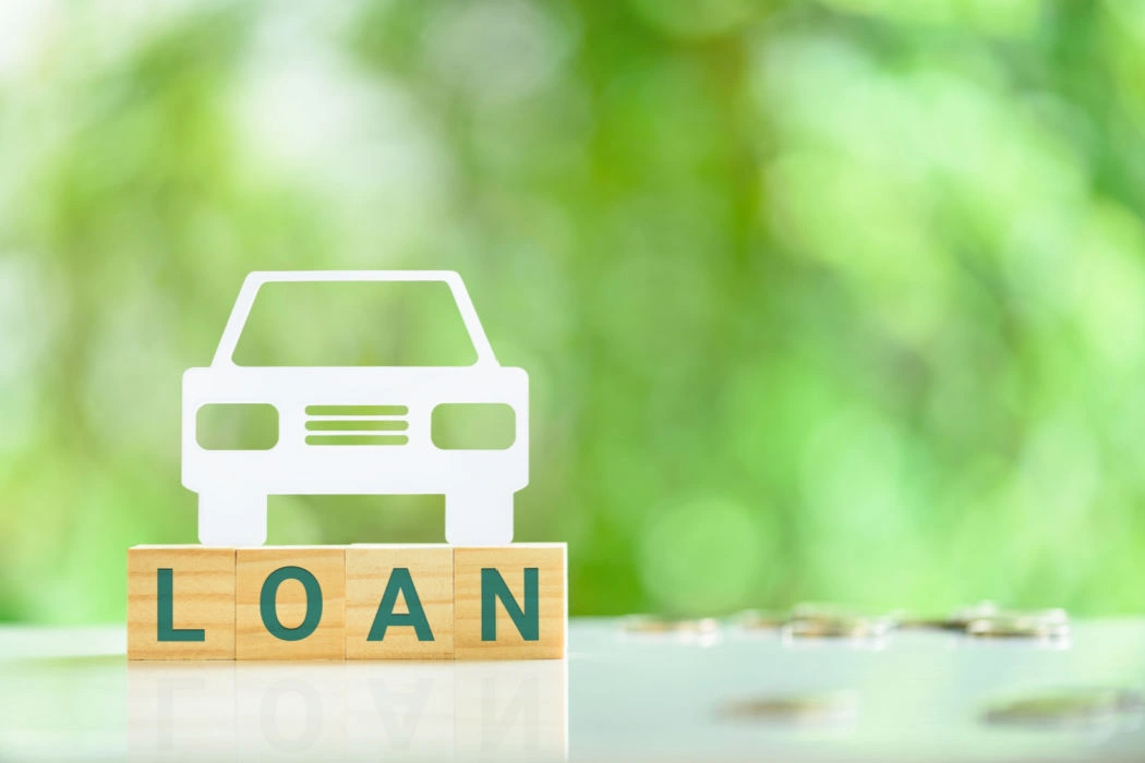 A paper cutout of a car to represent an auto-title-loan