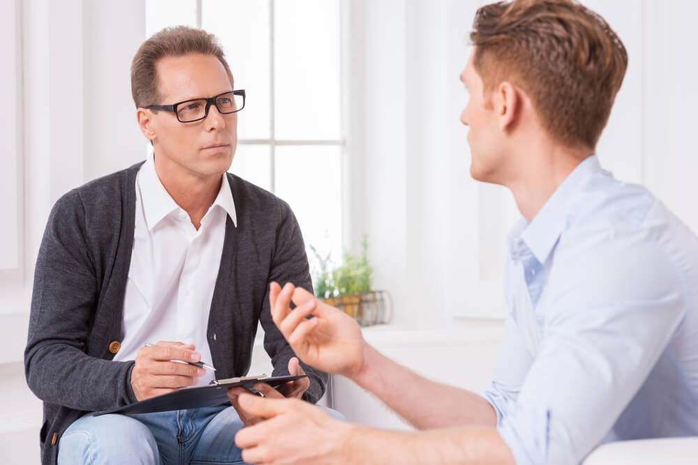 person meeting with title pawn representative for payday advance