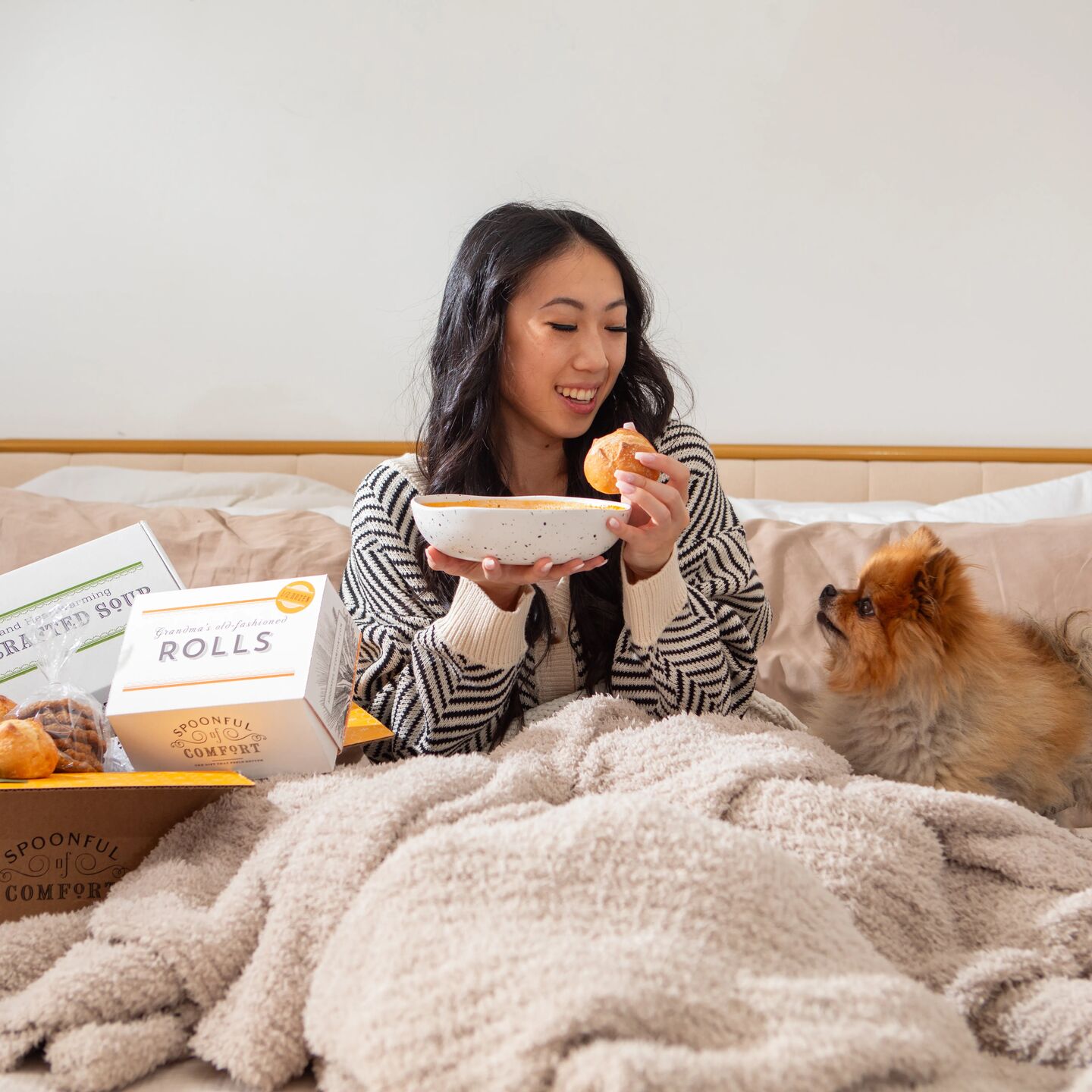 A woman holding a Spoonful of Comfort Package