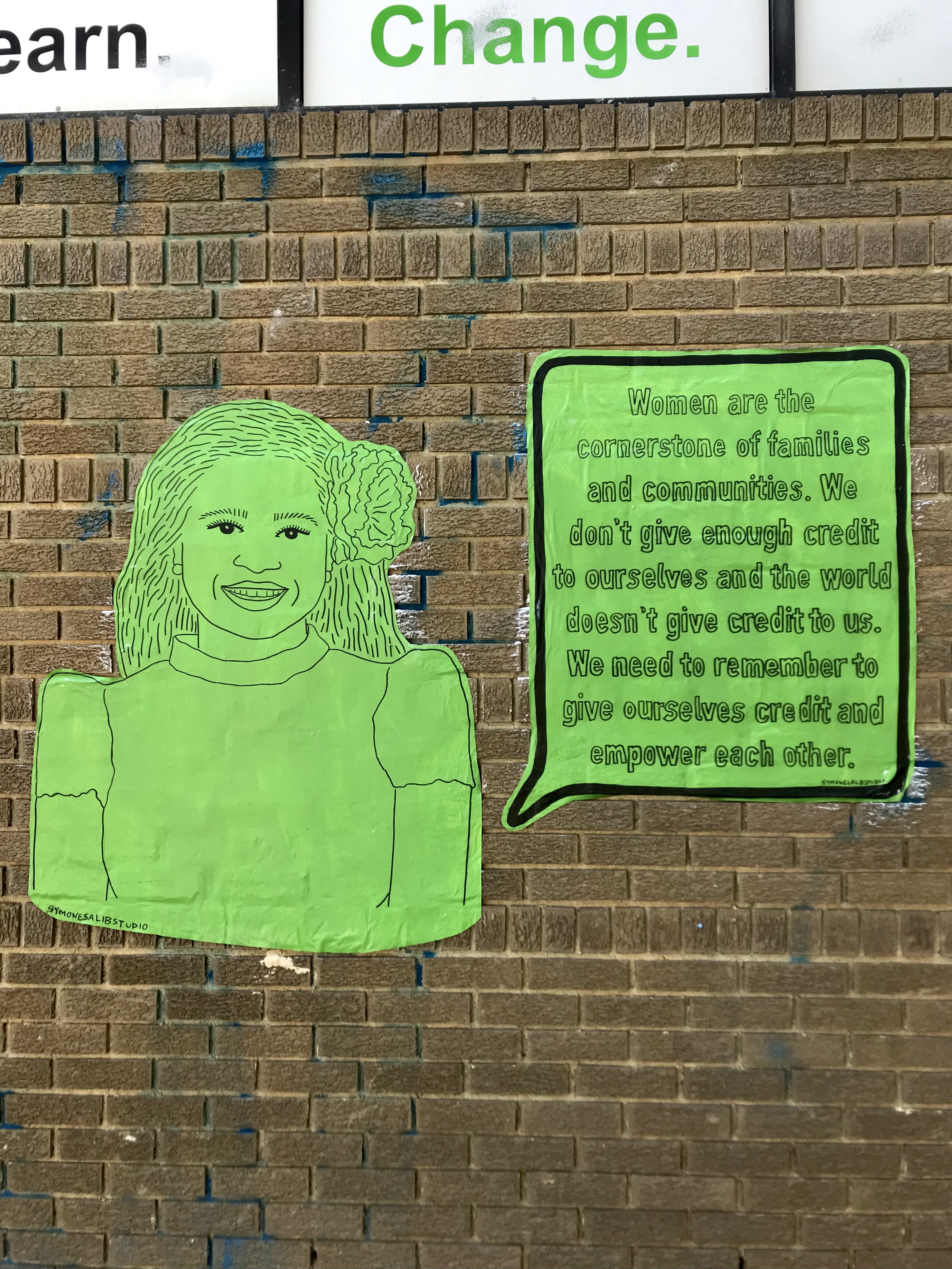 art portrait on brick wall
