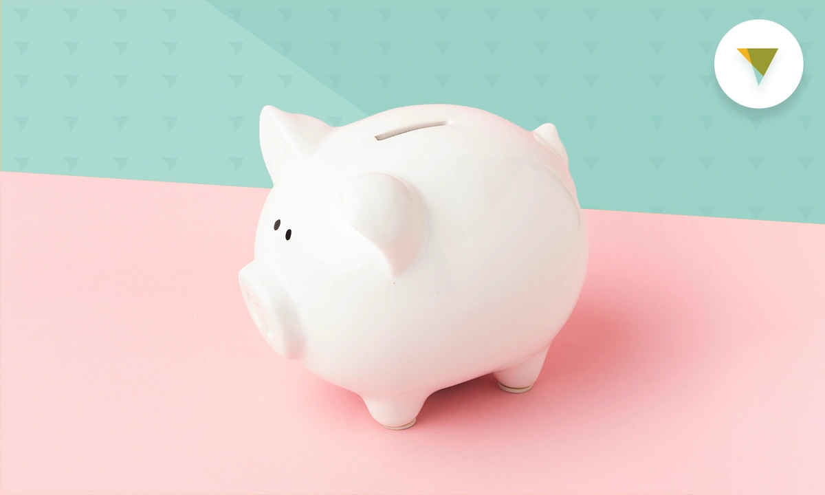 White piggy bank on a pink background