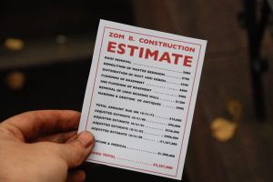 hand holding a card with an estimate on it