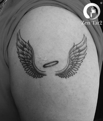 angel wing tattoos on upper arm