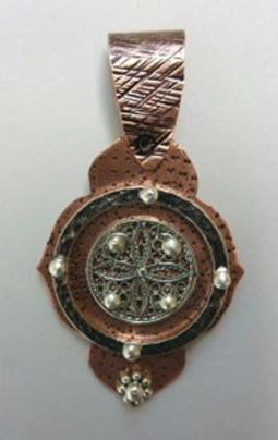 copper and silver layered pendant connected with ball rivets