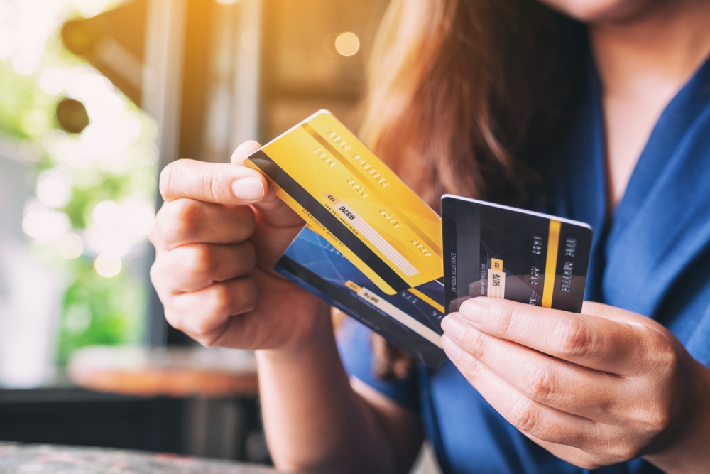 woman holding credit cards