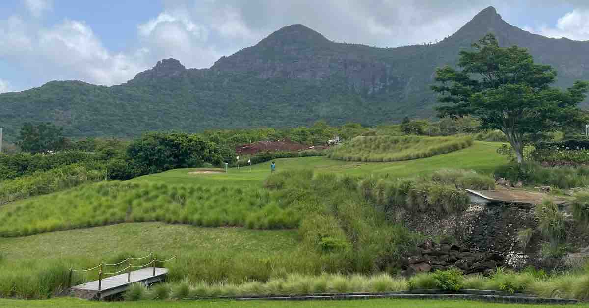 Golf course with mountains in the background