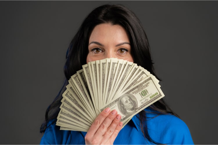Woman holding title loan cash in Nevada after getting approved.