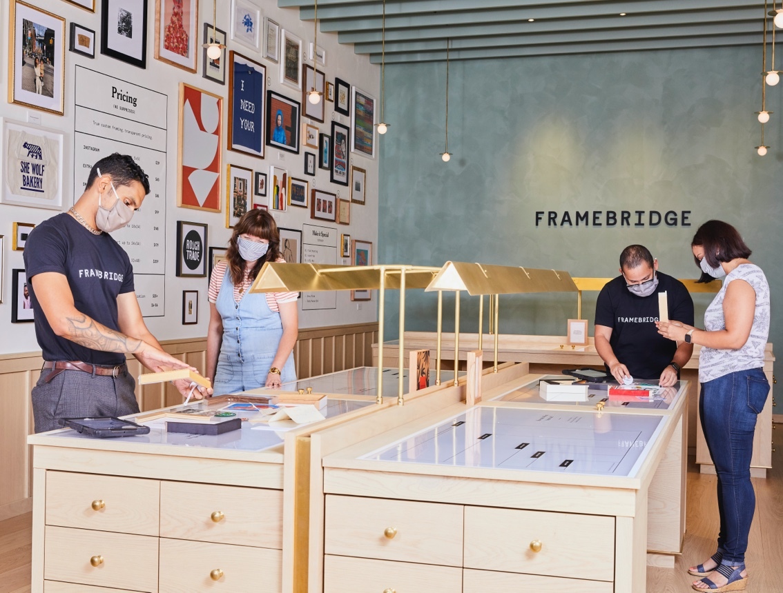 Framebridge store with people working