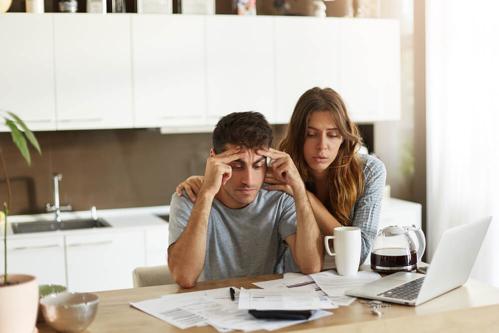 couple stressed about financial emergency 
