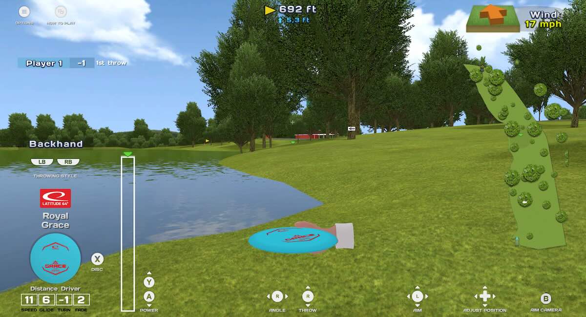 Screenshot from a disc golf video game with a disembodied hand holding a blue disc in a fairway with water, grass, and trees