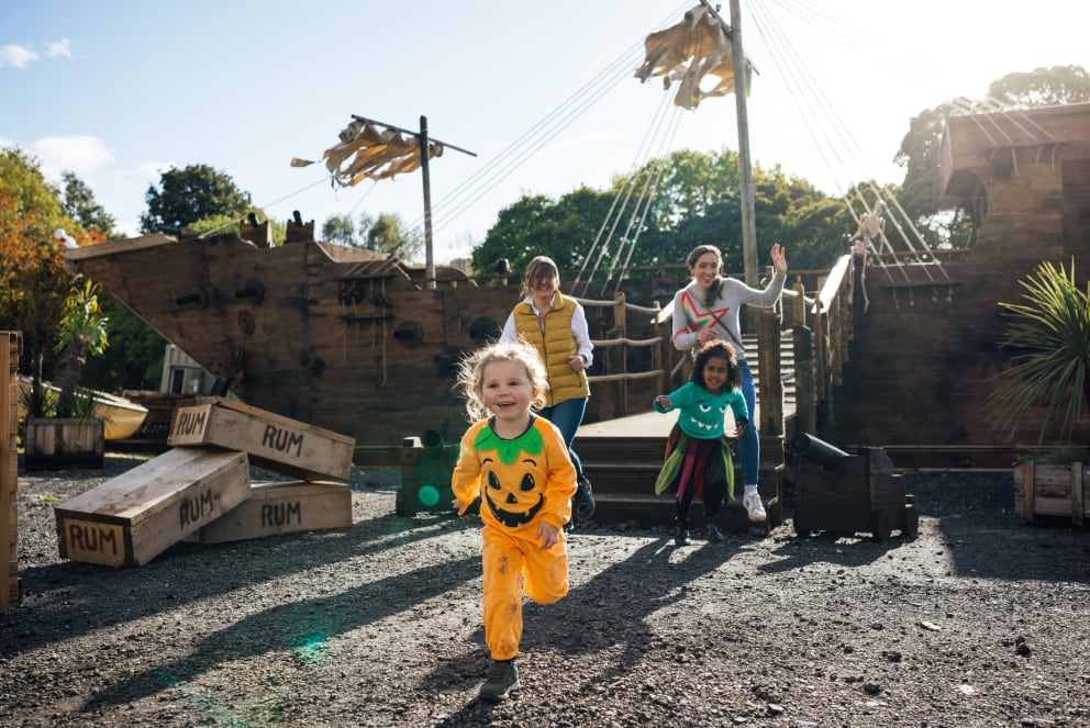 kids playing on a pirate ship during halloween