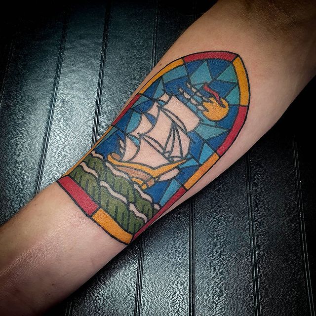 simple tattoo with color price quote boat in stained glass