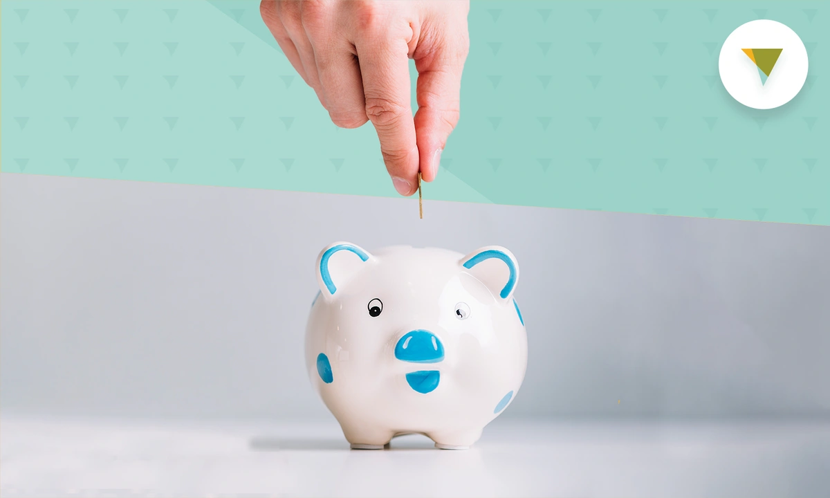 hand-putting-coin-in-piggy-bank.webp