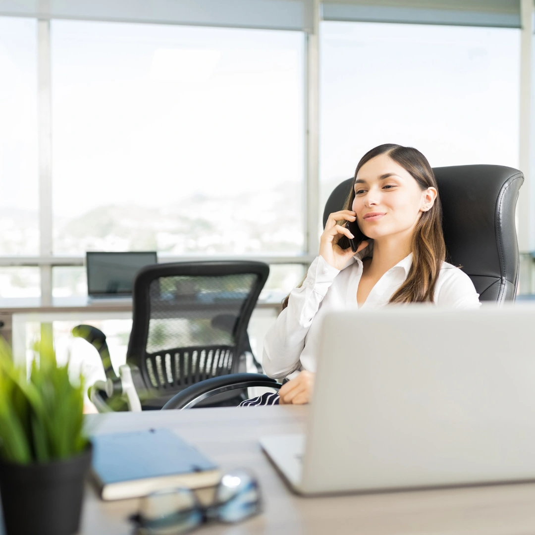 Woman making a call to a lead.