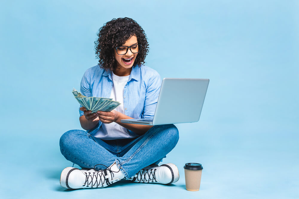 woman with online title loan cash in hand