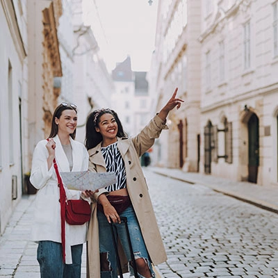 Women traveling with cross-body bags.