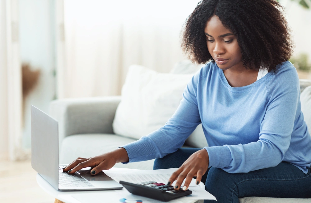 Woman doing finances at her laptop