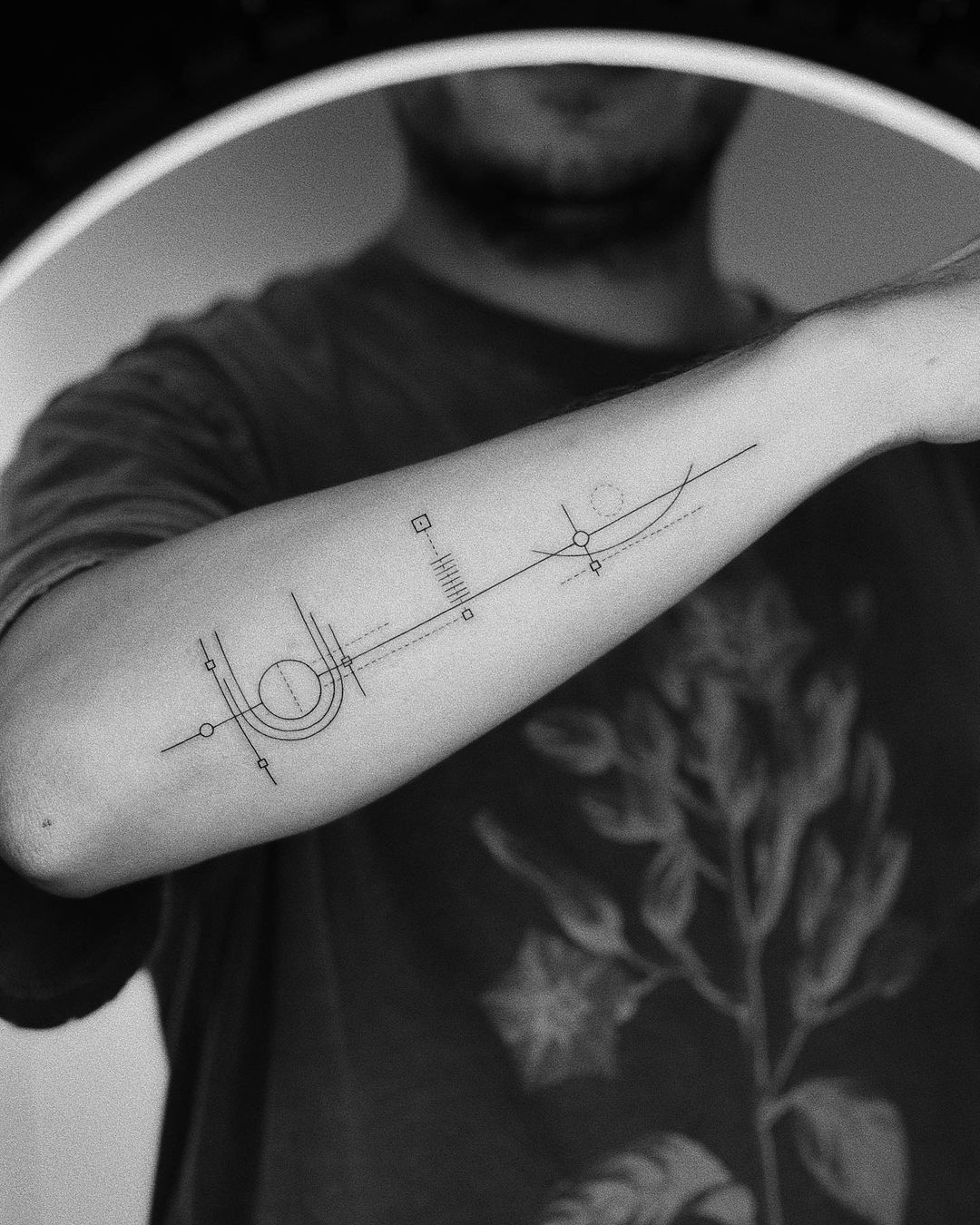 minimalist geometric tattoo by okan uckun