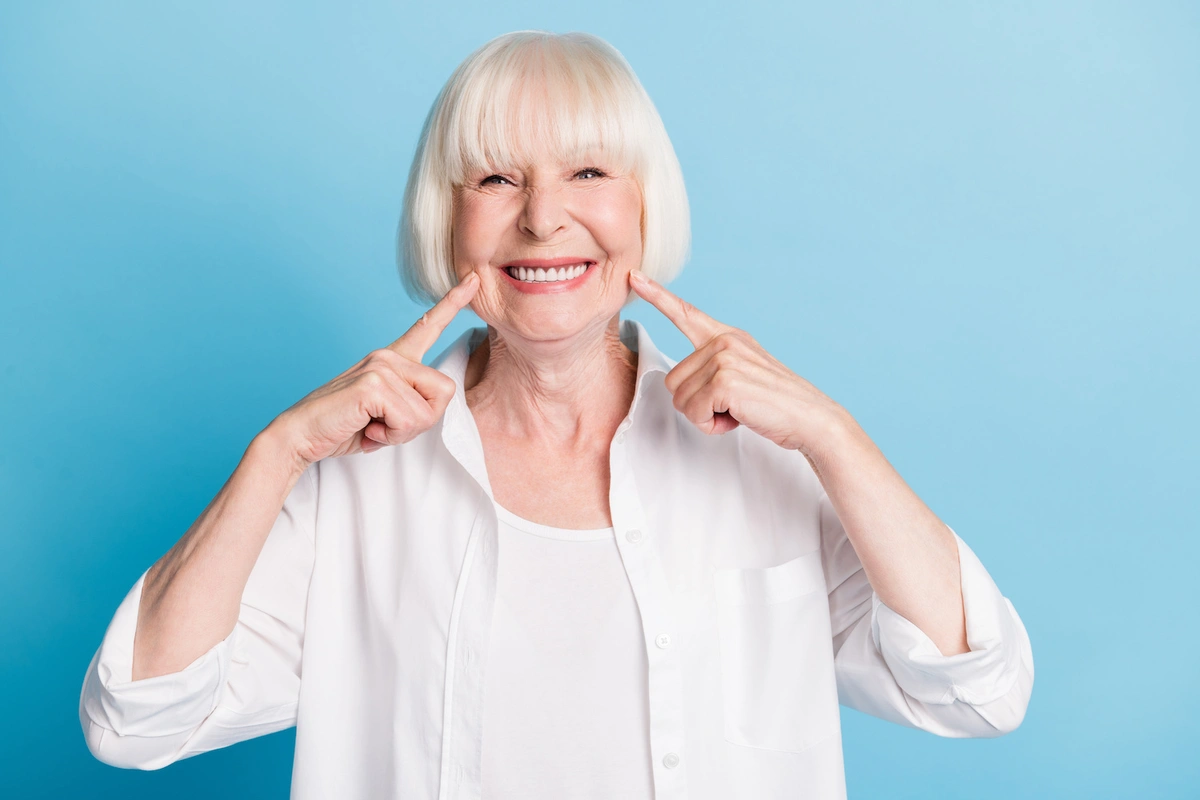 woman smiling because she has dental insurance in Arizona