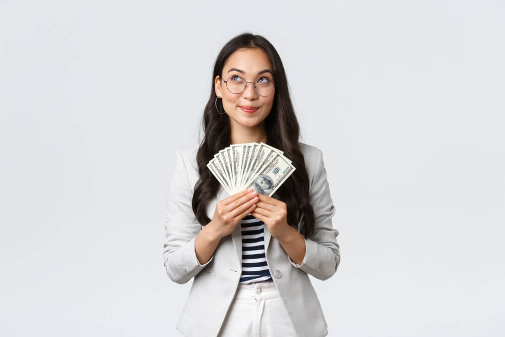 Asian woman with payday loan cash