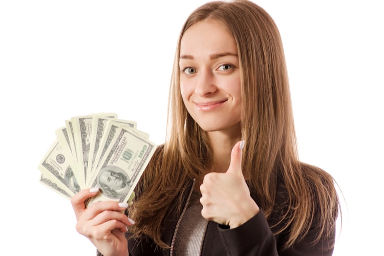 Woman holding title loan cash