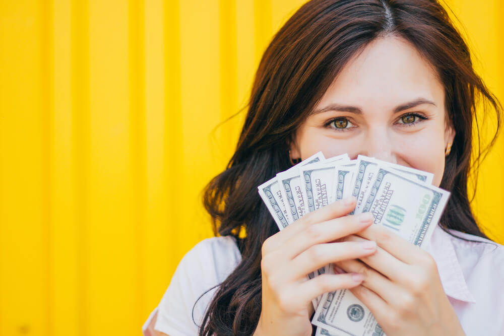 woman happy about payday loan cash