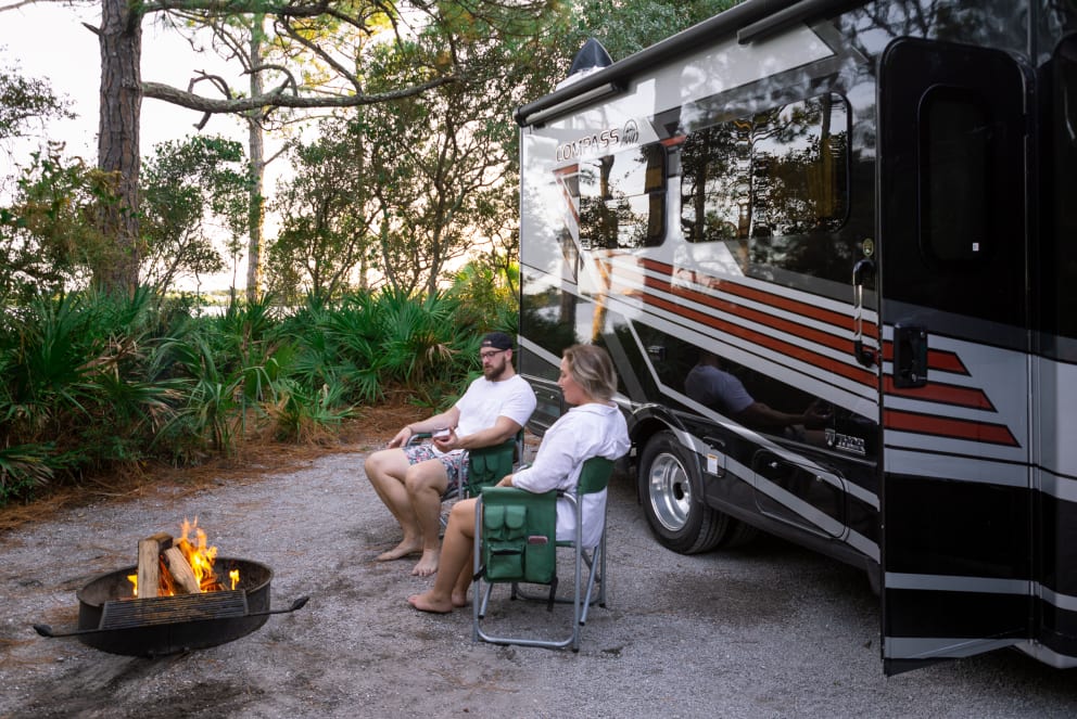 couple camping in florida in their compass rv