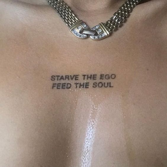 quote tattoo on woman's chest