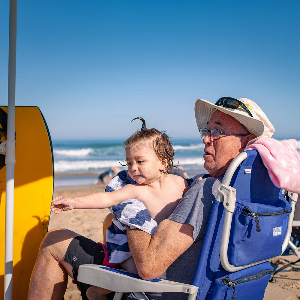 GrandpaandBabyatBeach.webp